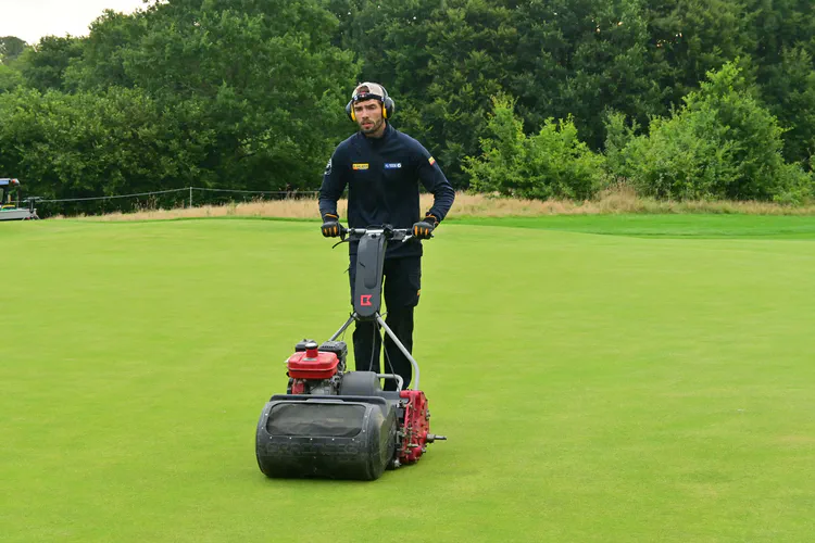 Mowing the 8th green.