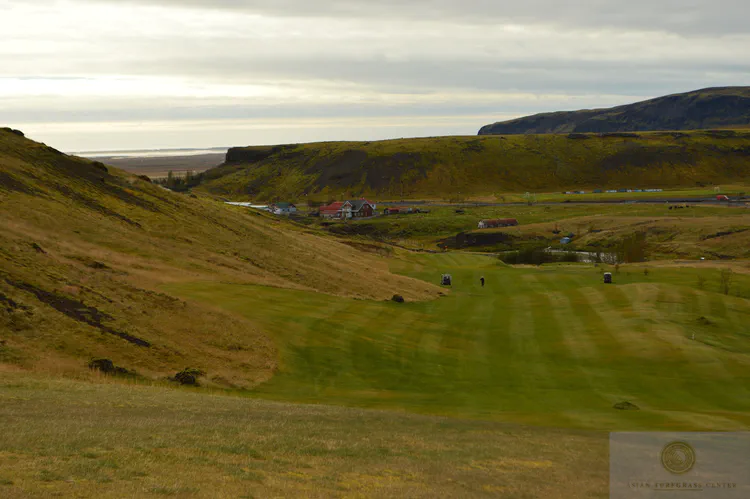 downhill 2nd at Hveragerdi GC: After successfully navigating past and to the right of the steam vent, one plays downhill to the wide open fairway.