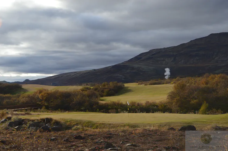 The Strokkur geyser erupts behind what will become the 9th at Geysir GC.