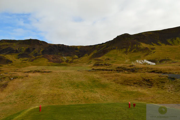 The uphill par four 1st at Hveragerdi GC is a blind shot towards active steam vents.