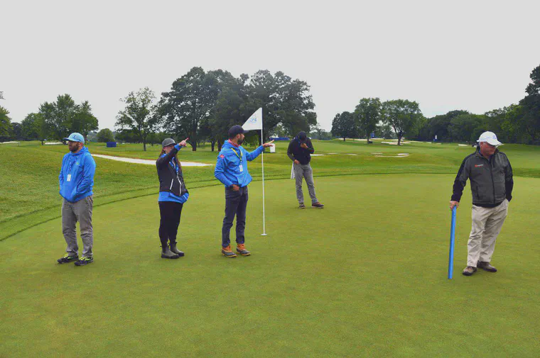 Contemplating green speed and clipping volume during the 2019 KPMG Women's PGA Championship.