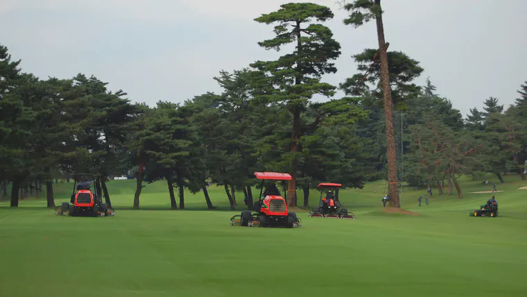 Mowing the 12th hole on the West Course.