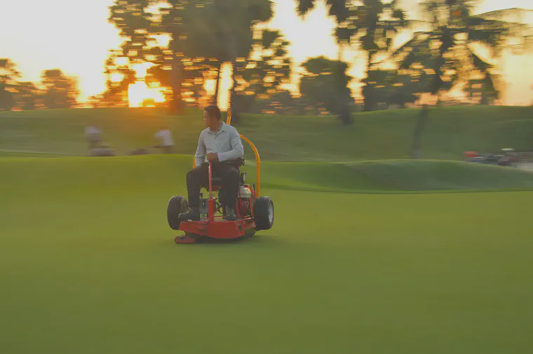 Rolling a Tifeagle putting green at Nikanti Golf Club in December.