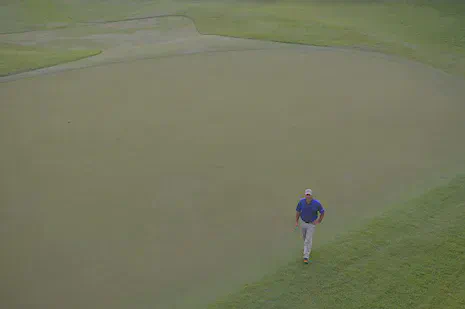 Superintendent Andrew McDaniel on the eighth green in August 2014---note the absence of fairy rings.