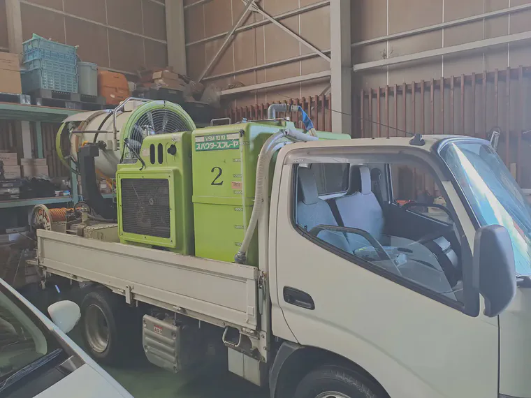 A spouter sprayer inside the distributor's warehouse.