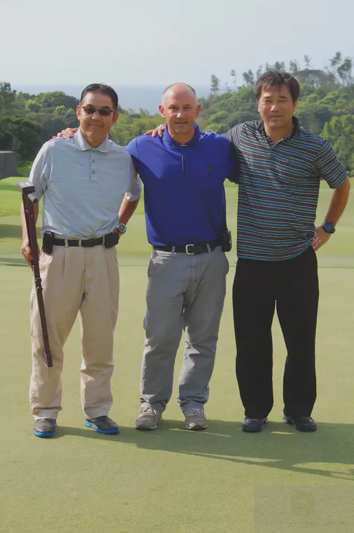 Three greenkeepers.