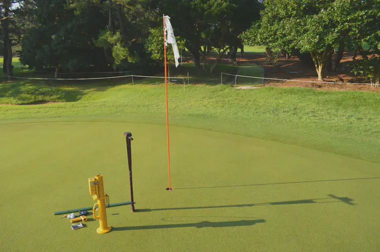 Clegg impact soil tester, TDR-300 soil moisture meter, stimpmeter, and soil and surface thermometers used to collect performance and environmental data from putting greens.
