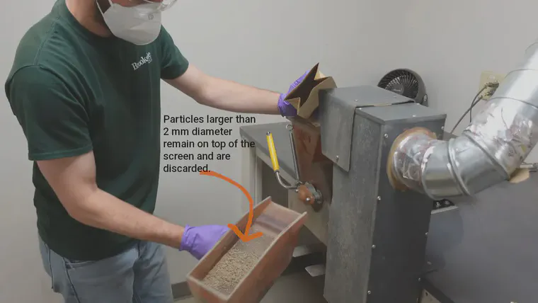 A grinding machine and sieve at Brookside Laboratories.