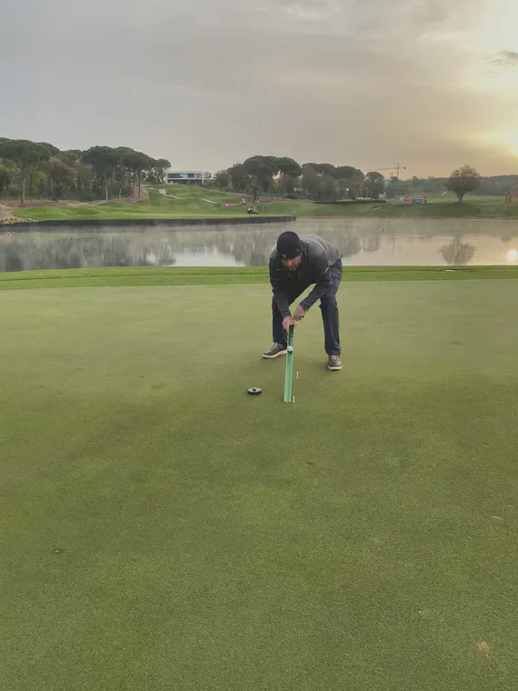 Making a stimpmeter measurement on the front of the third green at PGA Catalunya's Stadium Course. Photo by Graeme Macniven.