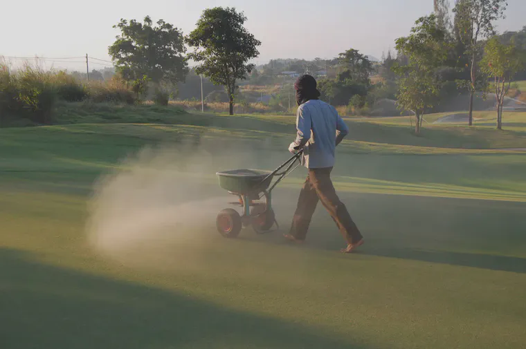 Adding sand to match the rate organic material is added to the soil will keep surface organic material constant.