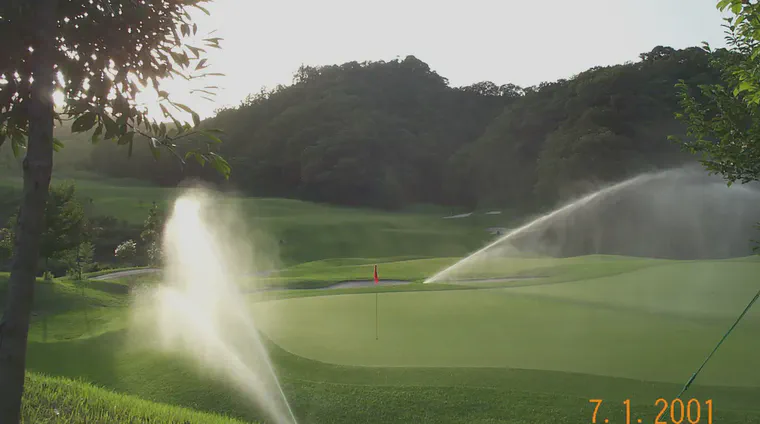 An early evening irrigation of the ninth green at Habu CC.