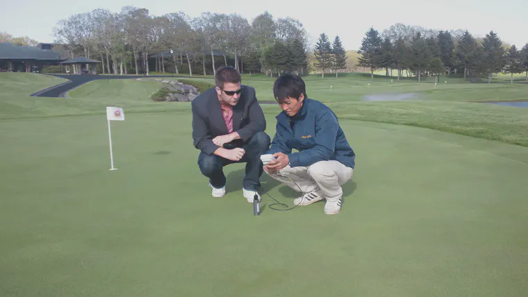 Checking volumetric water content of a bentgrass practice green at Hokkaido Classic GC.