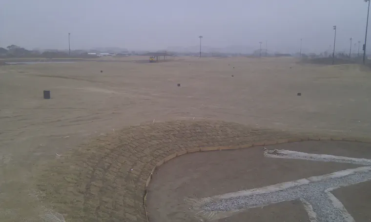 *Zoysia japonica* sod planted around a bunker in a checkerboard pattern, South Korea